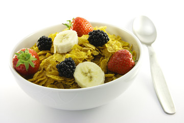 Cornflakes and Fruit in a White Bowl with Spoon