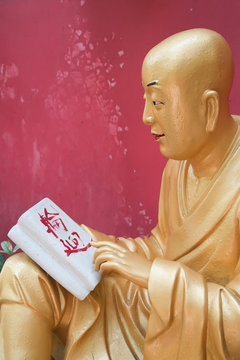 Statue of Buddah by the monastery of the ten thousand buddahs