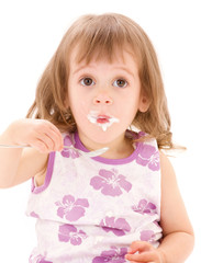 little girl with yogurt