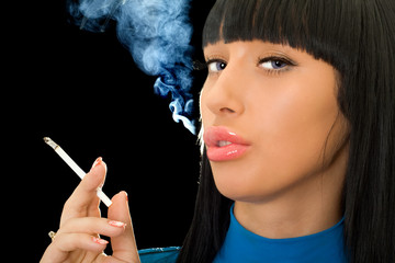 Obraz premium Portrait of the cute woman with a cigarette
