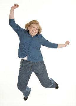 Middle Age Woman Jumping For Joy