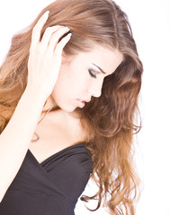 Obraz premium romantic young woman touching her long brown hair