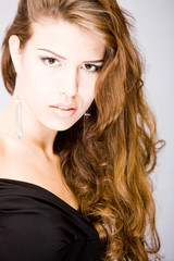 Fototapeta premium young woman with curly splendid long hair