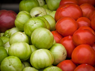 Green and red tomatoes at an Arlington market