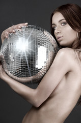 Naklejka premium beautiful naked woman with disco ball