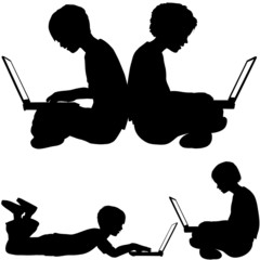 irl and boy use laptops sitting or lying on the ground