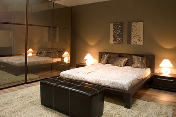 Interior of modern bedroom with mirrors