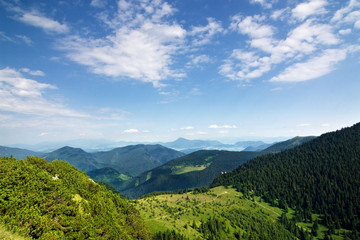 Fototapeta na wymiar Mountain-ridge and blue sky with white clouds