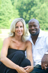 A beautiful mixed race couple enjoying the park