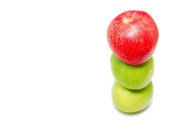 Red apple at the top of a pile of apples
