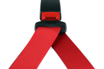 Red seat belt clasped on the lock