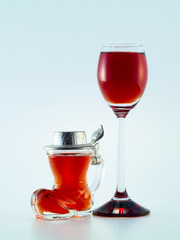 small glass filled with colorful liquor