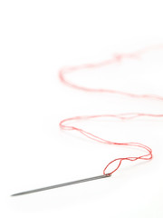 needle with the red thread