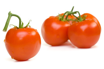 Ripe red tomatoes on a white background with clipping path
