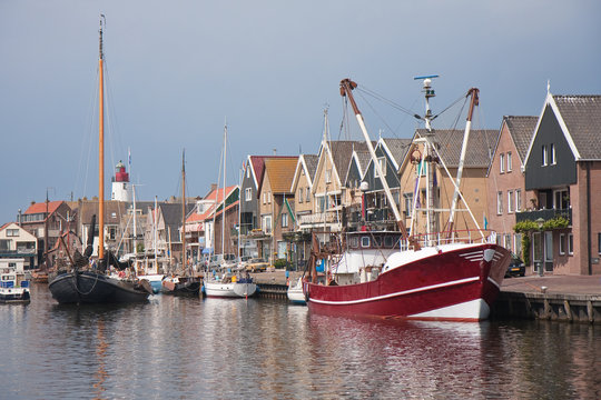 Traditional and modern fishing cutter in the harbor of Urk, the