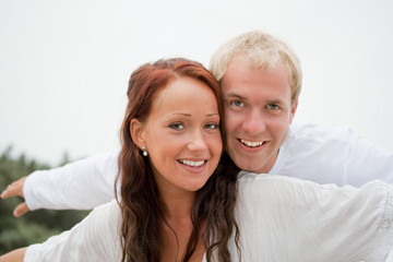 Young couple having fun on the beach