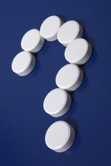 Question mark of white tablets