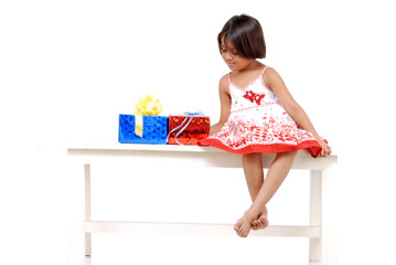 little girl with christmas presents