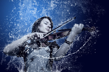 Musician playing violin under water