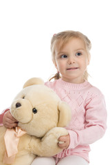 Little girl holding a teddy bear