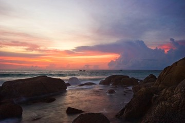 Tropical sunset on the rocks