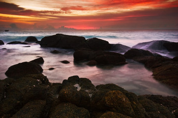 Tropical sunset on the rocks