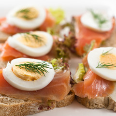 Canapes with salmon and eggs