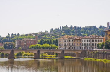 Fototapeta premium Colorful Buildings Past Arno Bridge