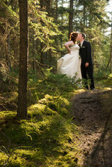 Bride and Groom Kissing in Fairy Tale Forest