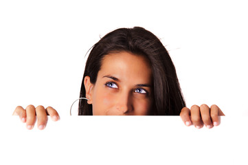 Portrait of a beautiful girl looking up into the corner