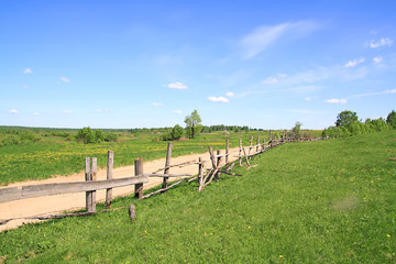 Fototapeta na wymiar old fence on field