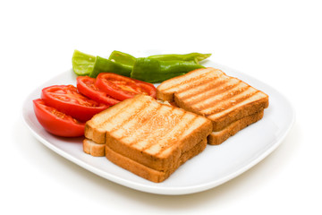 Delicious toasts with sliced tomatoes and green peppers