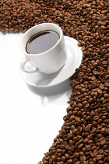 Cup with coffee, costing on coffee grain