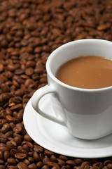 Cup with coffee, costing on coffee grain