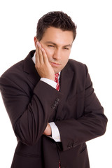 Young business man whith a toothache over white background