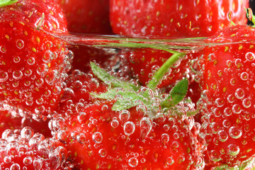 Strawberries in water close up