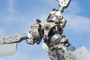 helicopter tail rotor blade mechanism against blue sky