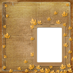 Old grunge frame on the abstract background with autumn leaves