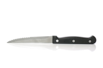 Steak knife on white