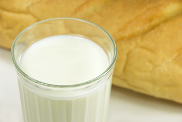Glass with milk and bread