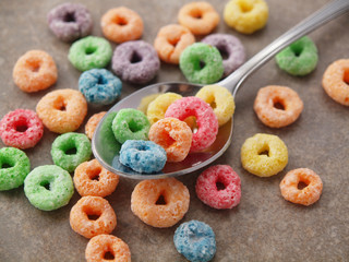 Round Fruit sugar Cereal on Spoon