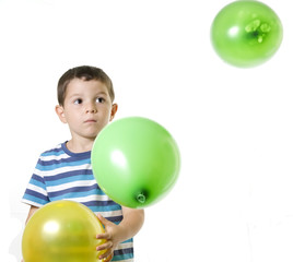 Fototapeta na wymiar Kid playing with baloons