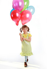 little girl holding colorful balloons on a white background