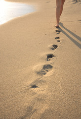 Fototapeta na wymiar beachwalk with footprints
