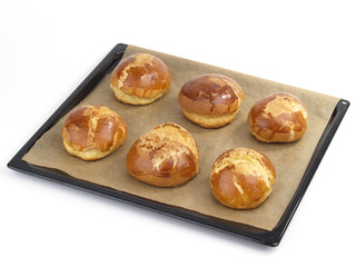 freshly baked bread buns in a tray