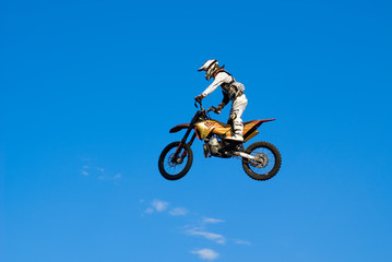 Obraz na płótnie Canvas flying biker