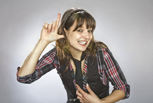 Young woman with an index finger up