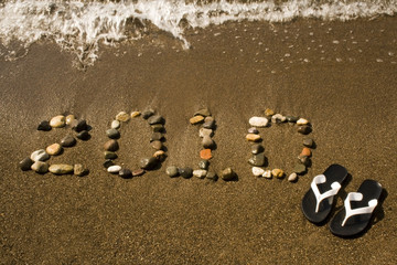 New year beach background with  flip flops