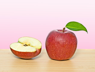 Red apple and section on table