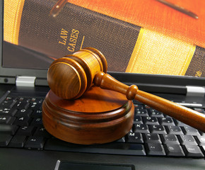judges court gavel on a laptop computer (cyber law)